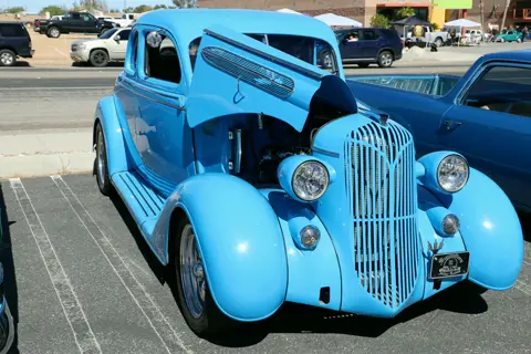 Electric blue custom 1930s coupe with chrome grille at the church car show