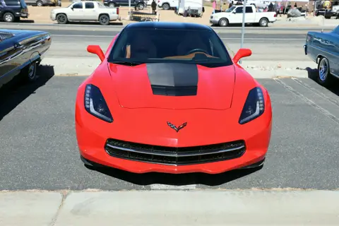 Red C7 Corvette Stingray facing the camera in the show lineup