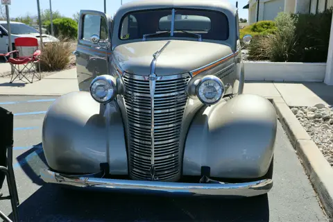 Champagne 1938 Chevrolet with polished chrome grille and headlights