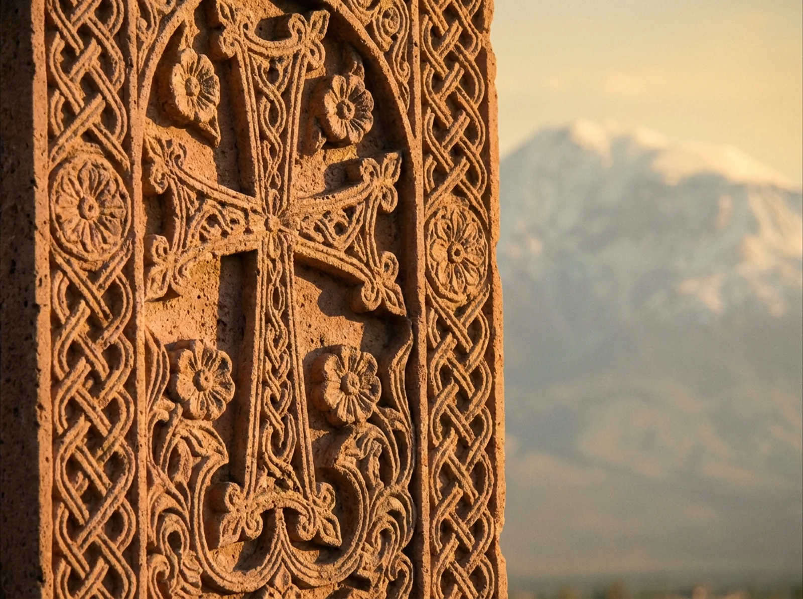 Hand-carved Armenian khachkar cross-stone with Mount Ararat beyond